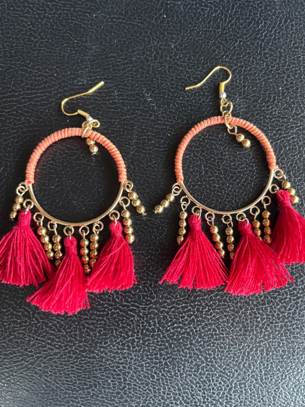 Vibrant Red Tassel Hoop Earrings with Gold Bead Accents